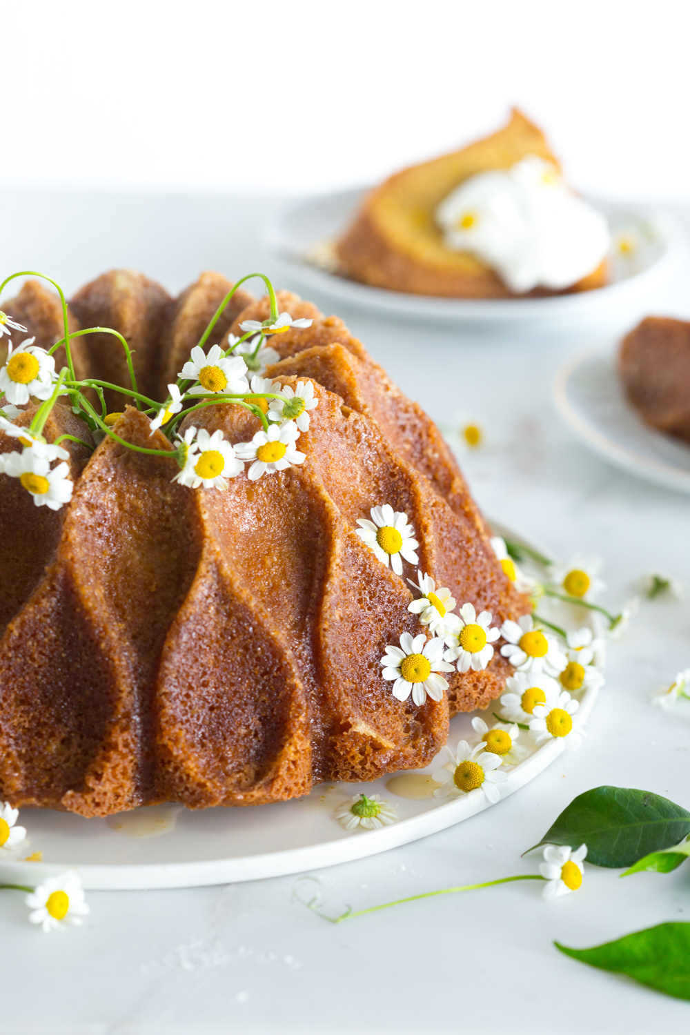 Lemon Chamomile Honey Bundt Cake with chamomile flowers