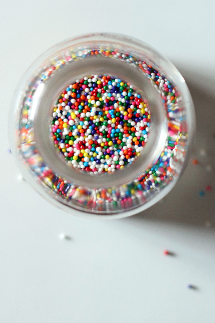 looking downward into a small jar of sprinkles