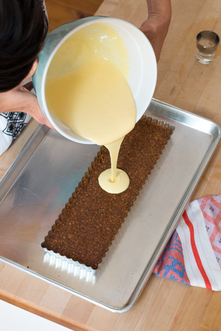 Gently pour the whisked tart filling into the pretzel crust shell.