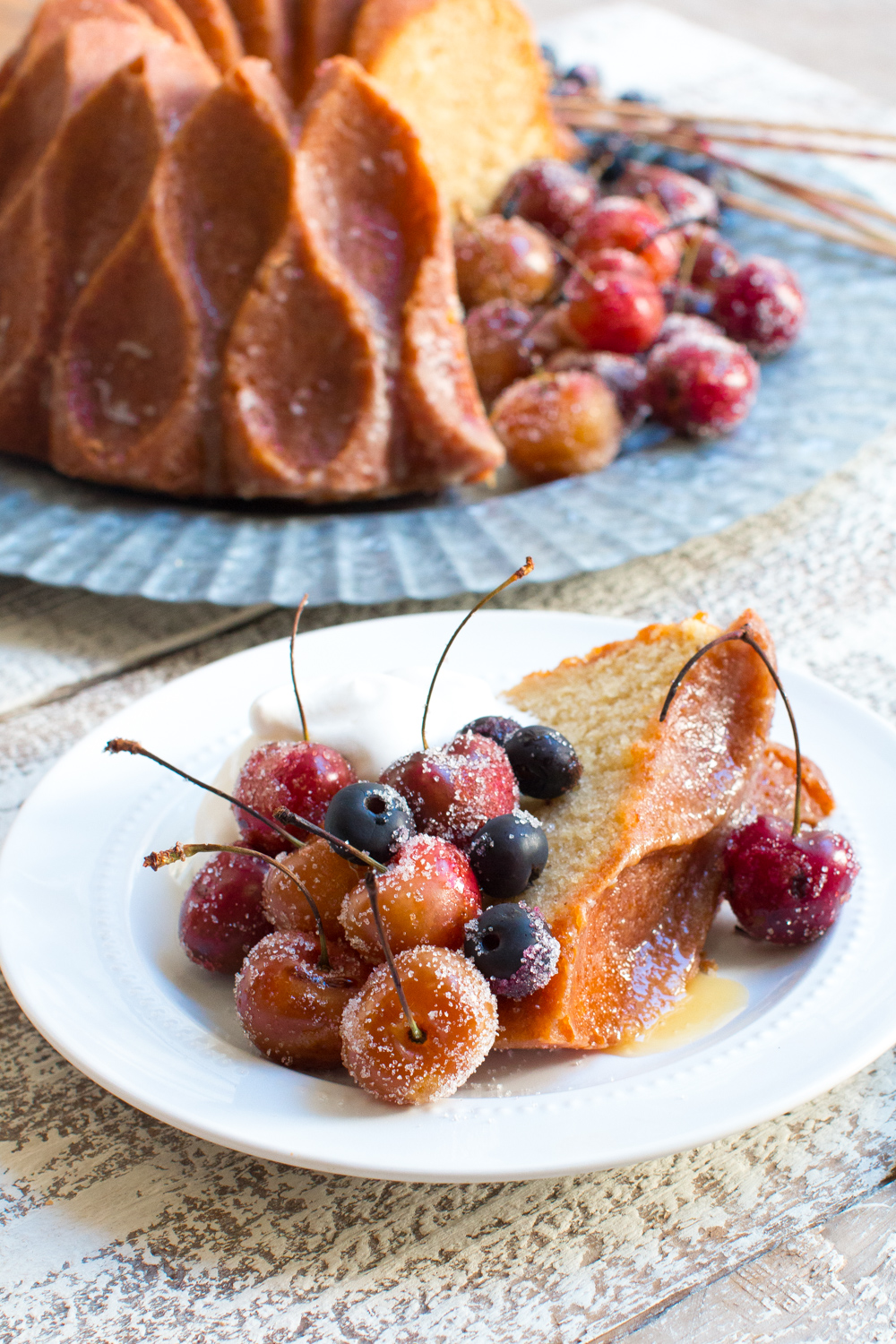 Brown Butter Bourbon Bundt Cake with Grilled Cherries, Blueberries and Whipped Cream