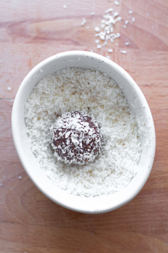 Protein Balls rolling in coconut