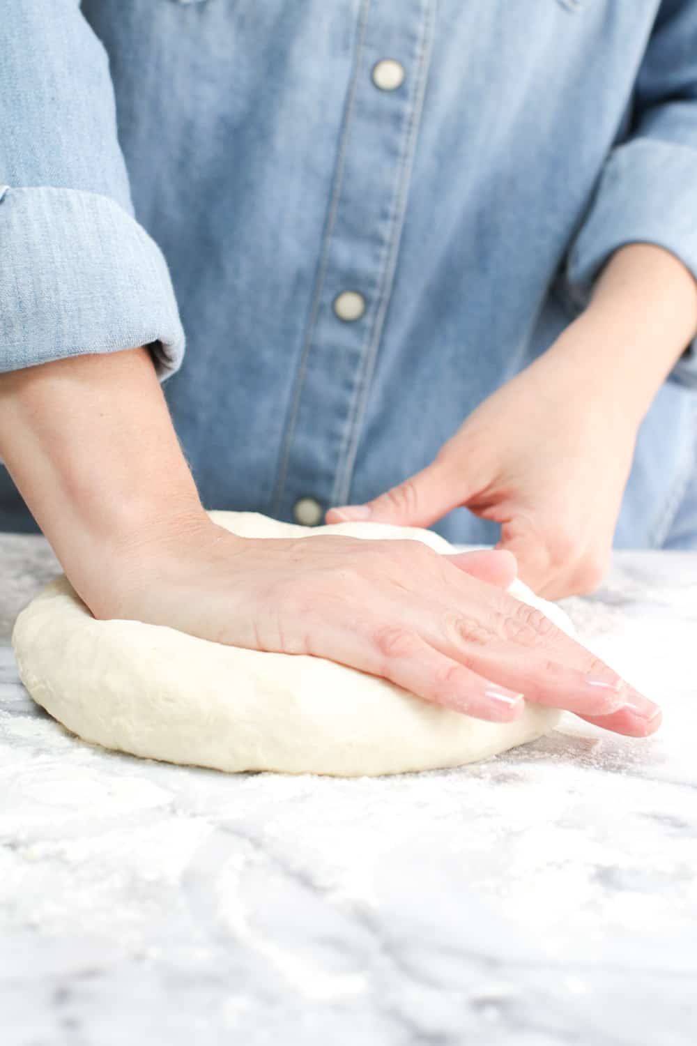 Gently kneading the dough for about 5 minutes to get rid of any clumps