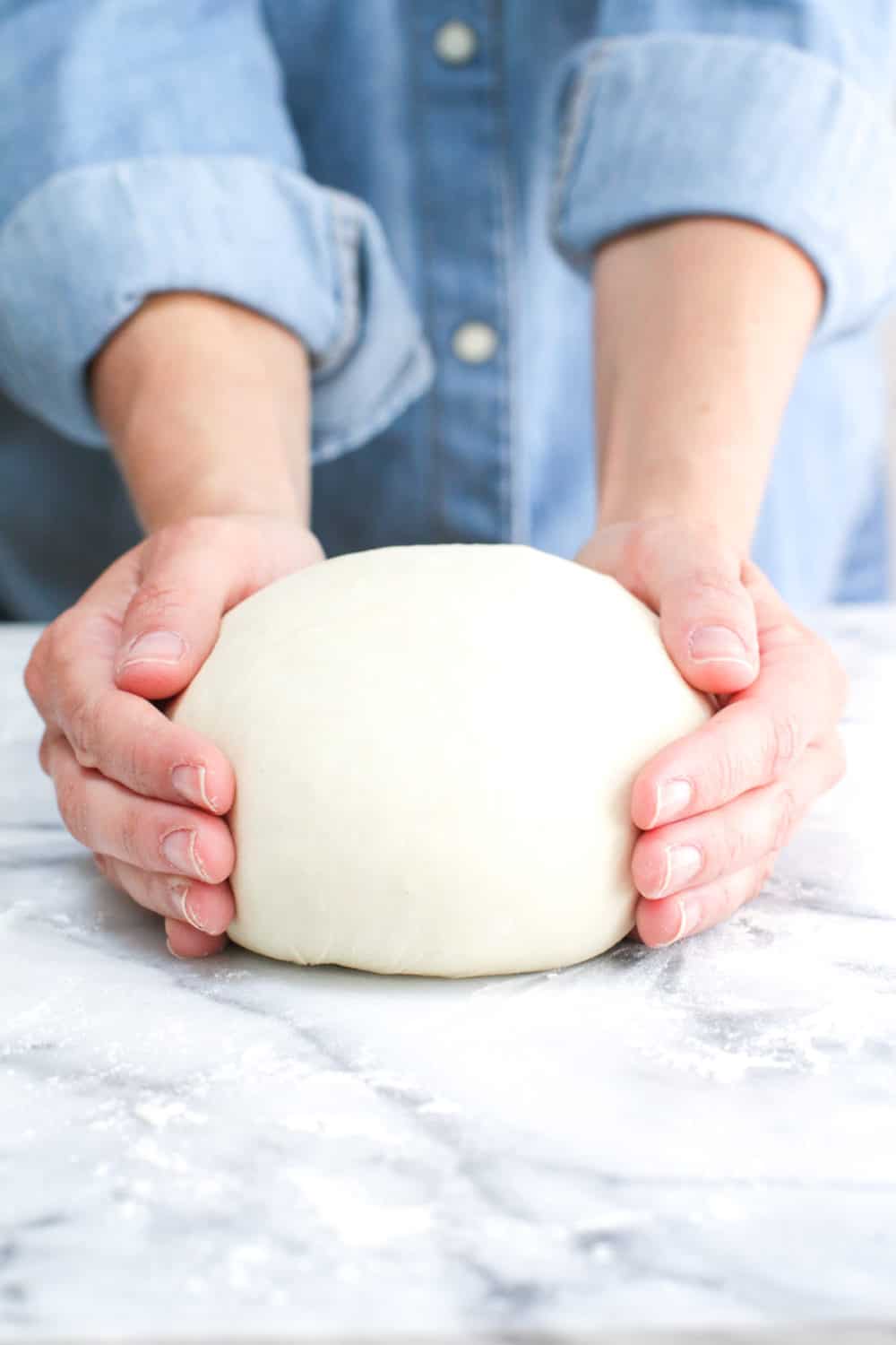 rolling pizza dough into a boule