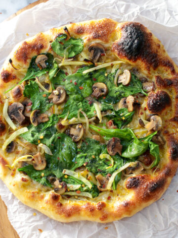 Garlic & Fennel Mushroom Pizza adapted from the original recipe from Life Is But A Dish and baked on Baking Steel.