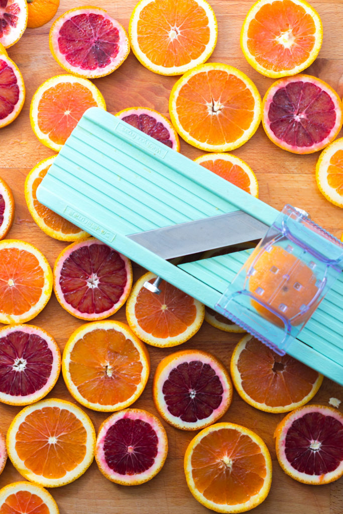 Broiled Orange Whipped Ricotta Toasts- slicing oranges