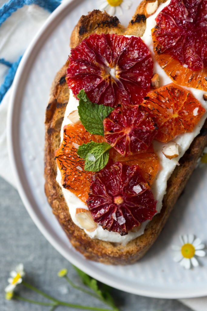Broiled Orange Whipped Ricotta Toasts with sea salt flakes