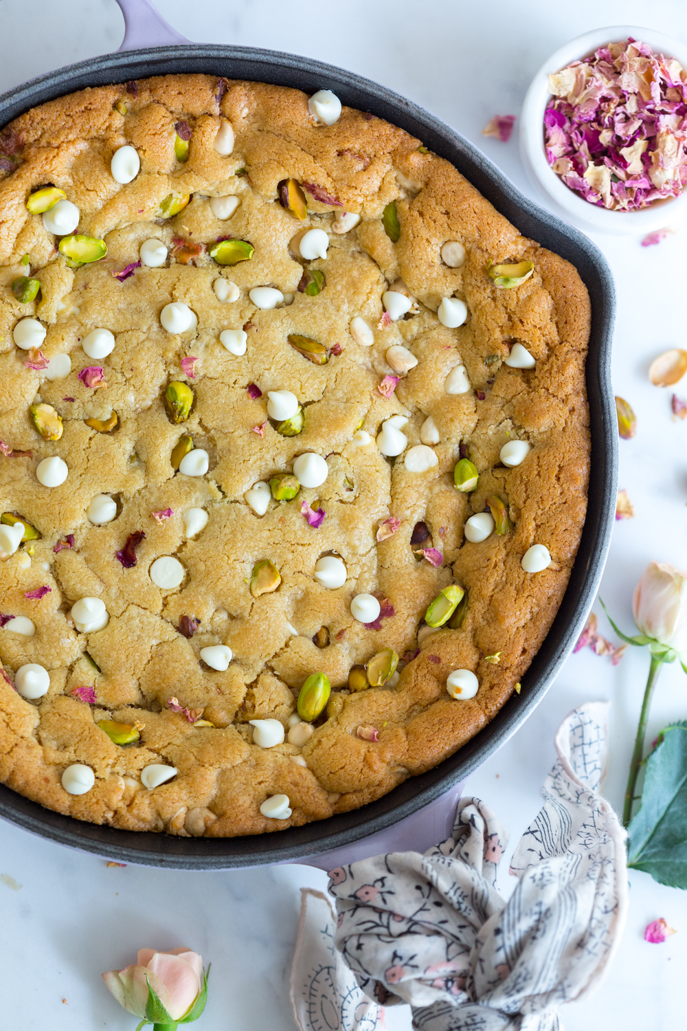 Tahini Skillet Cookie with white chocolate, pistachios and rose petals