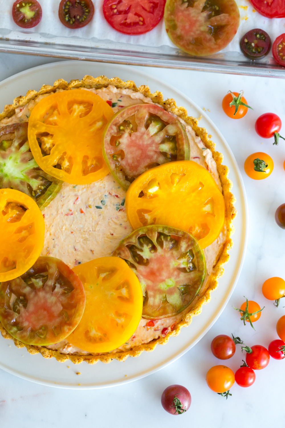 Layering the Heirloom Tomato and Pimento Cheese Tart with Cornmeal Crust