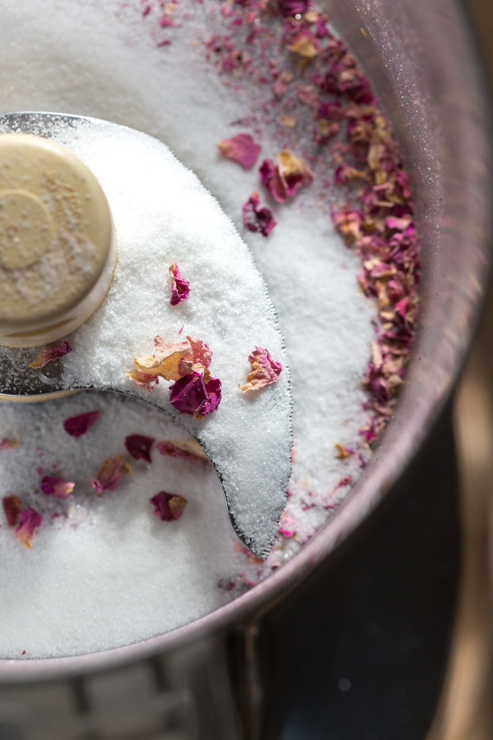 Grinding rose petals and sugar for Madeleines
