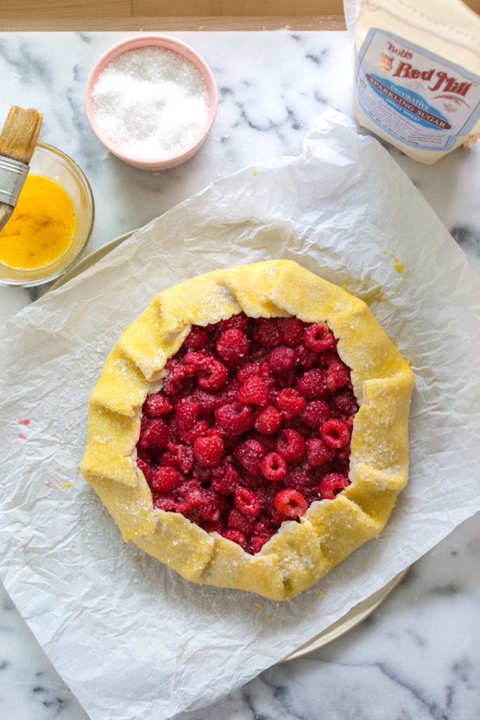 Adding egg wash to Raspberry Galette