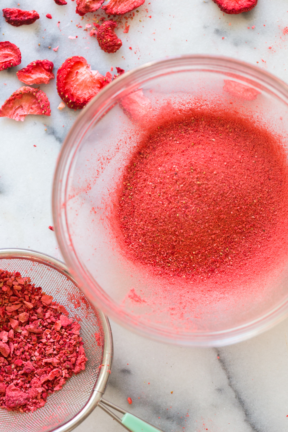 Sifting freeze dried strawberries for Strawberry Blondies