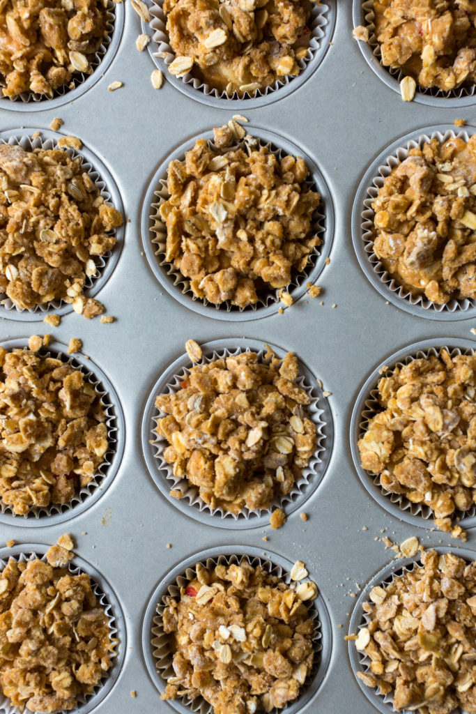 Filling muffin tin for Apple Cider Muffin batter in pan