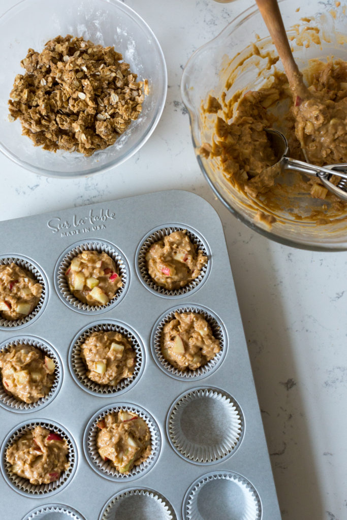 Filling muffin tin for Apple Cider Muffin batter