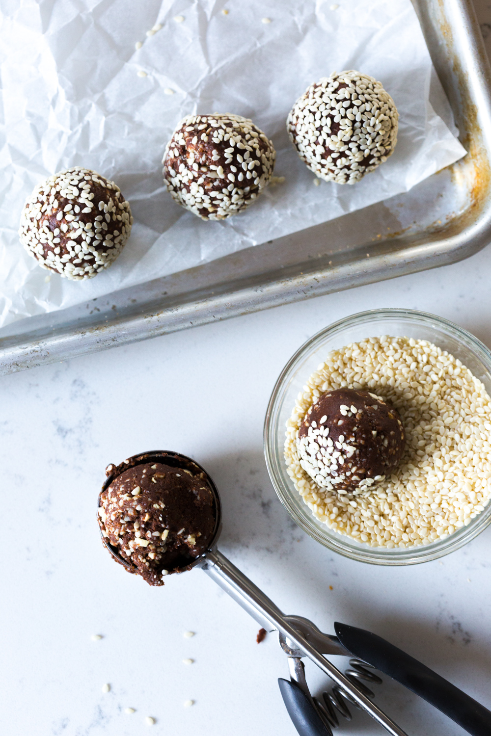 Rolling Cashew Date Chocolate Sesame Energy Balls