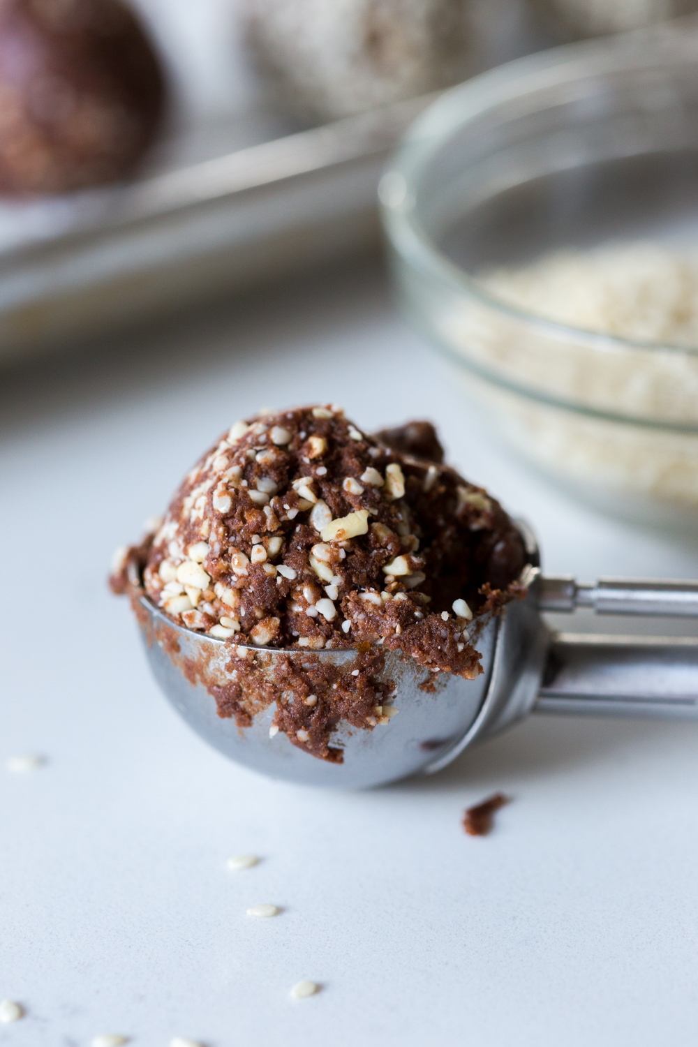 Scooping Cashew Date Chocolate Sesame Energy Balls