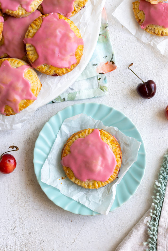 Cherry Hand Pies with Cream Cheese Crust on a plate