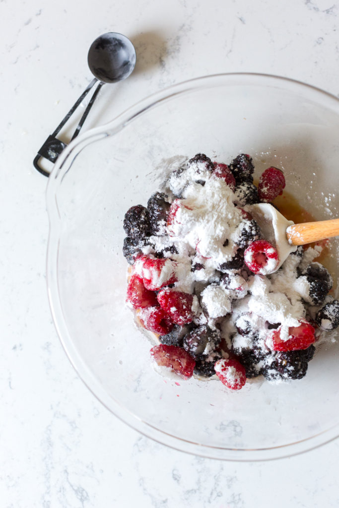 Mixing berries for cobbler