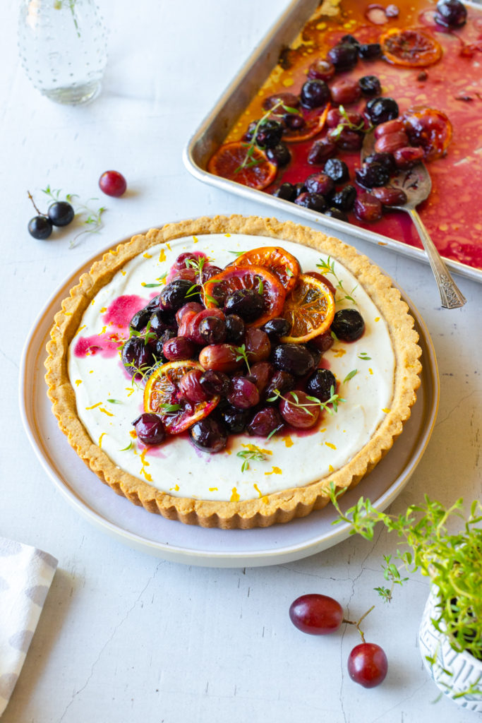 Topping Roasted Grape Goat Cheese Tart with grapes