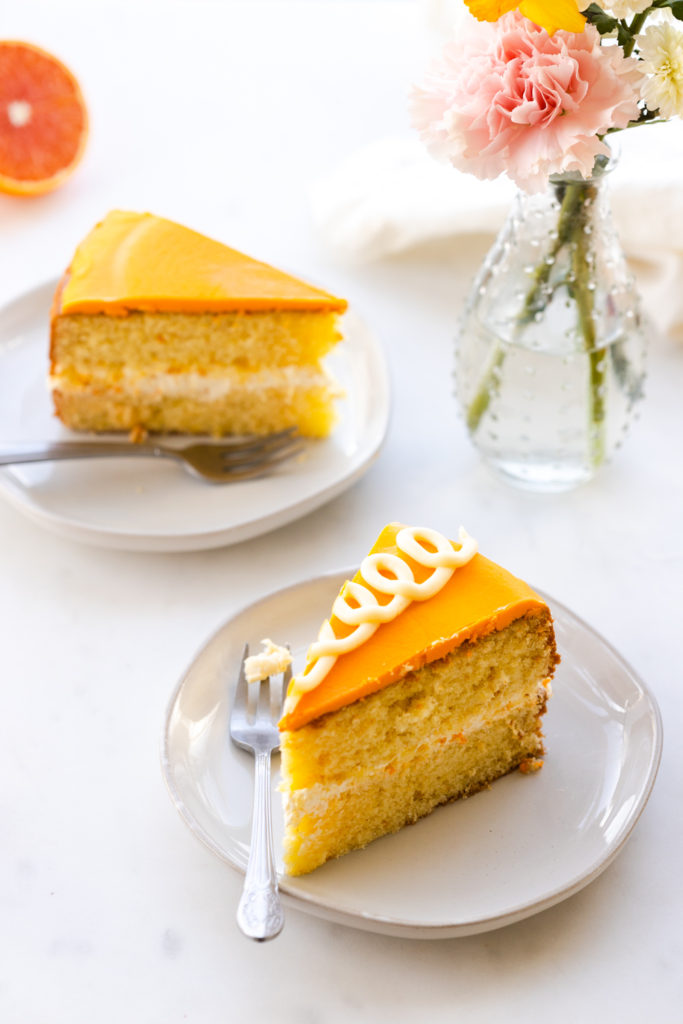Orange Cream Cake slices on a plate