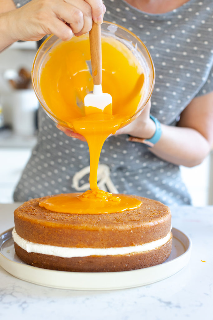 White Chocolate Orange Ganache creeping to the edges of the cake