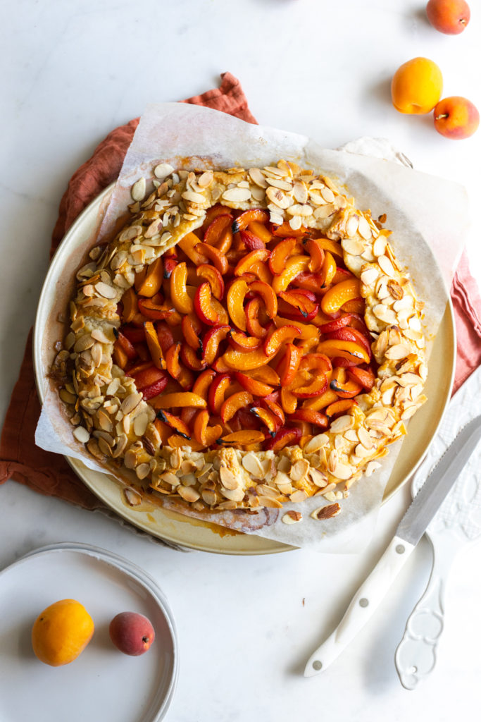 This elegant Apricot Almond Galette with Cream Cheese Crust features a tender crust with crunchy sliced almonds hugging around a sweet apricot filling.