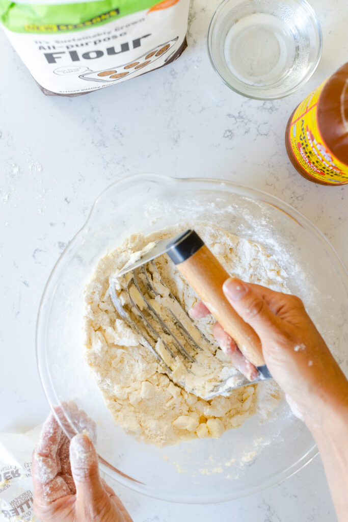 cutting in the butter with a pastry blender 