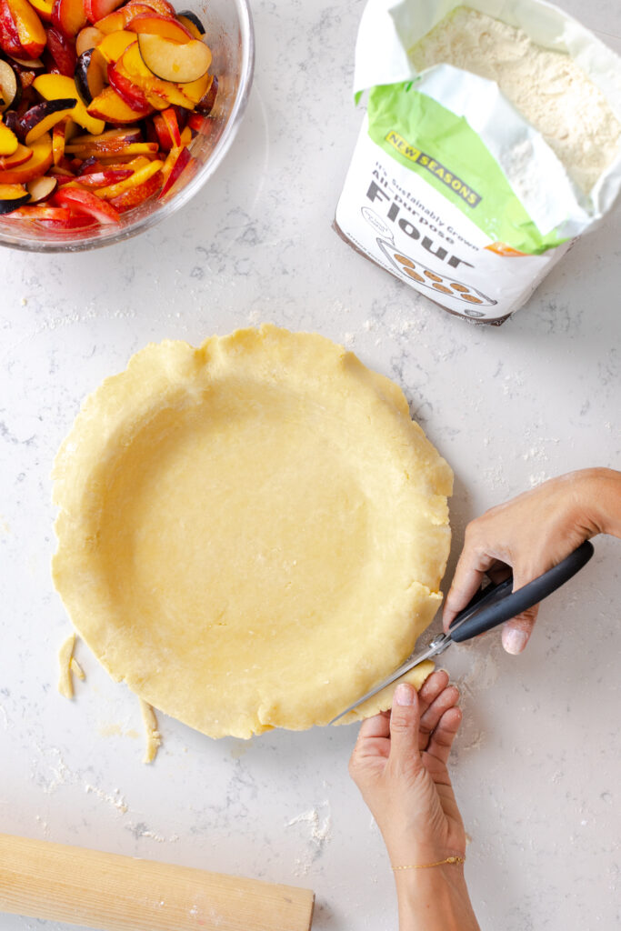 trimming bottom pie dough