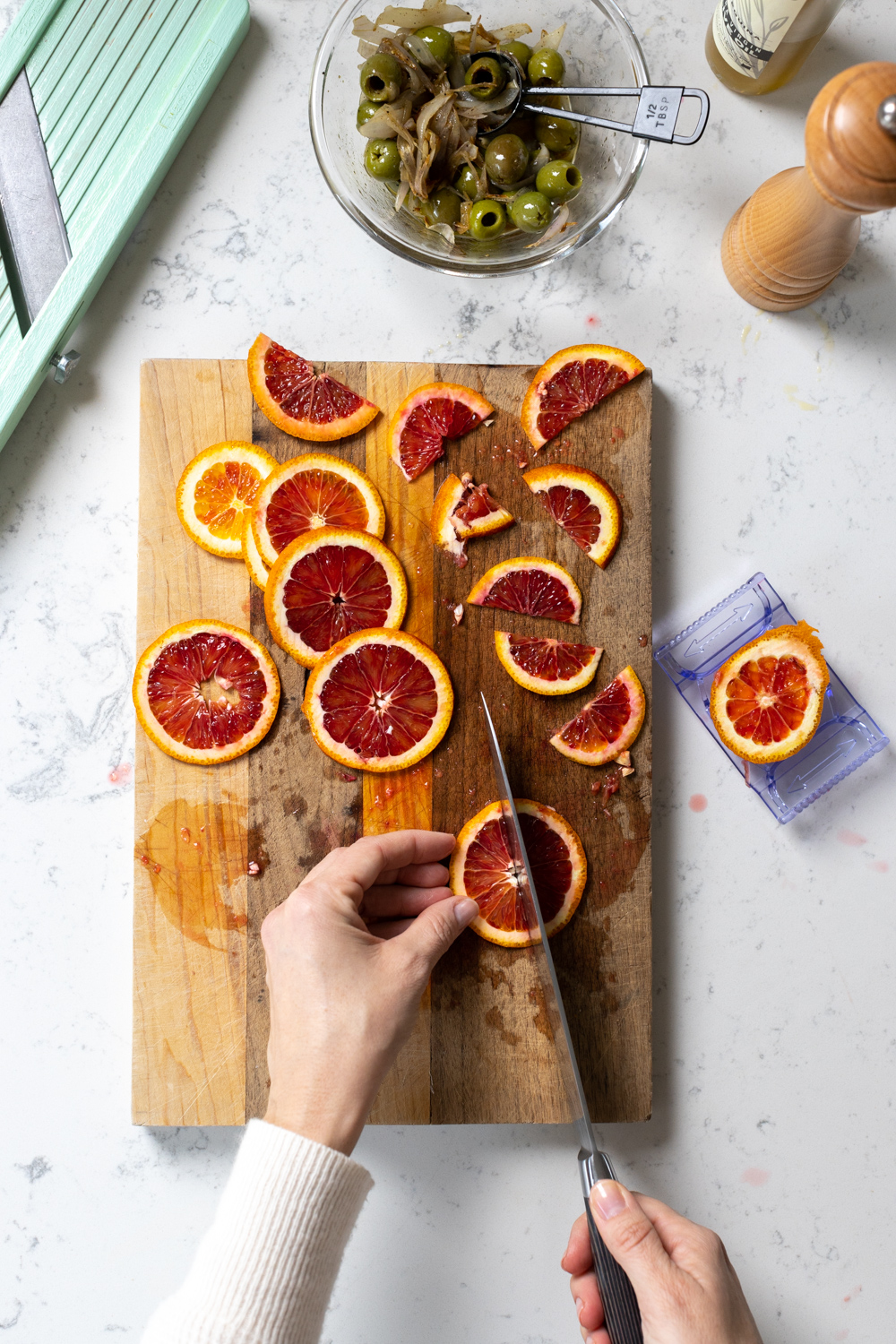 slicing blood oranges for focaccia