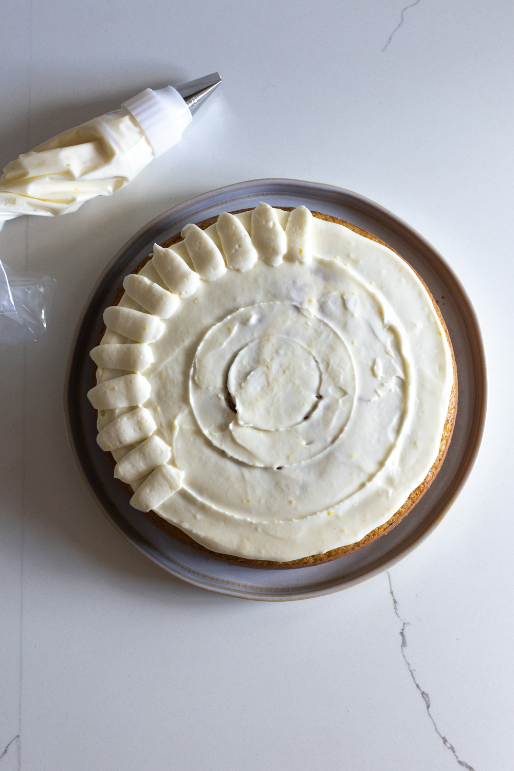 Decorating Artichoke Olive Oil Cake with Lemon Cream Cheese Frosting