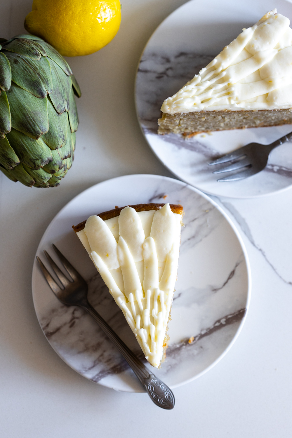 Slices of Artichoke Olive Oil Cake with Lemon Cream Cheese Frosting