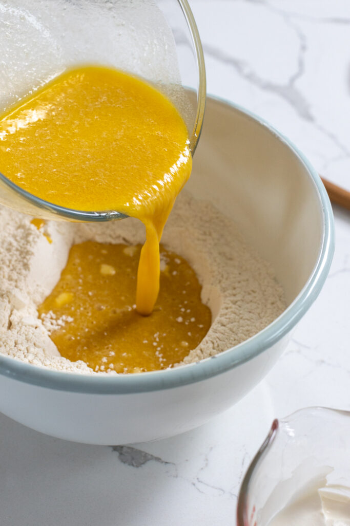 adding the wet ingredients to the dry coffee cake mixture