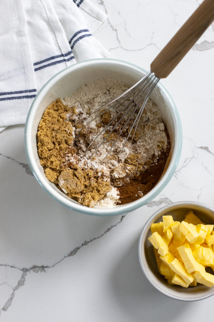 ingredients for coffee cake crumble topping in a bowl before being whisked