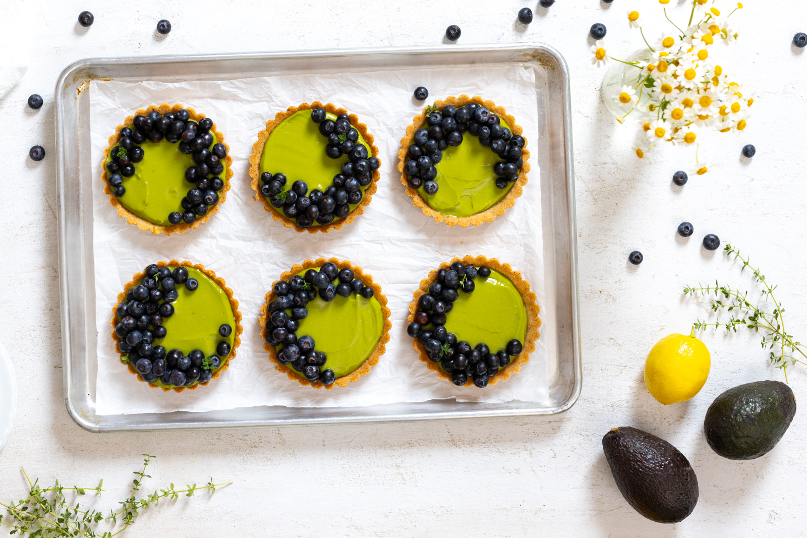 6 sweet little Avocado Blueberry Tarts with Almond Crust. The flavor and texture combo is a dream.