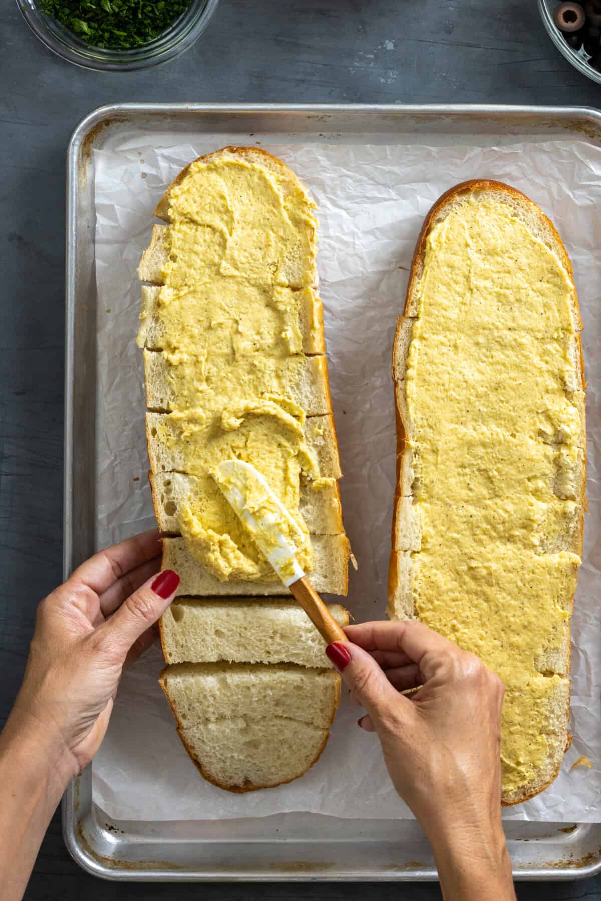 Topping bread with garlic bread butter mixture