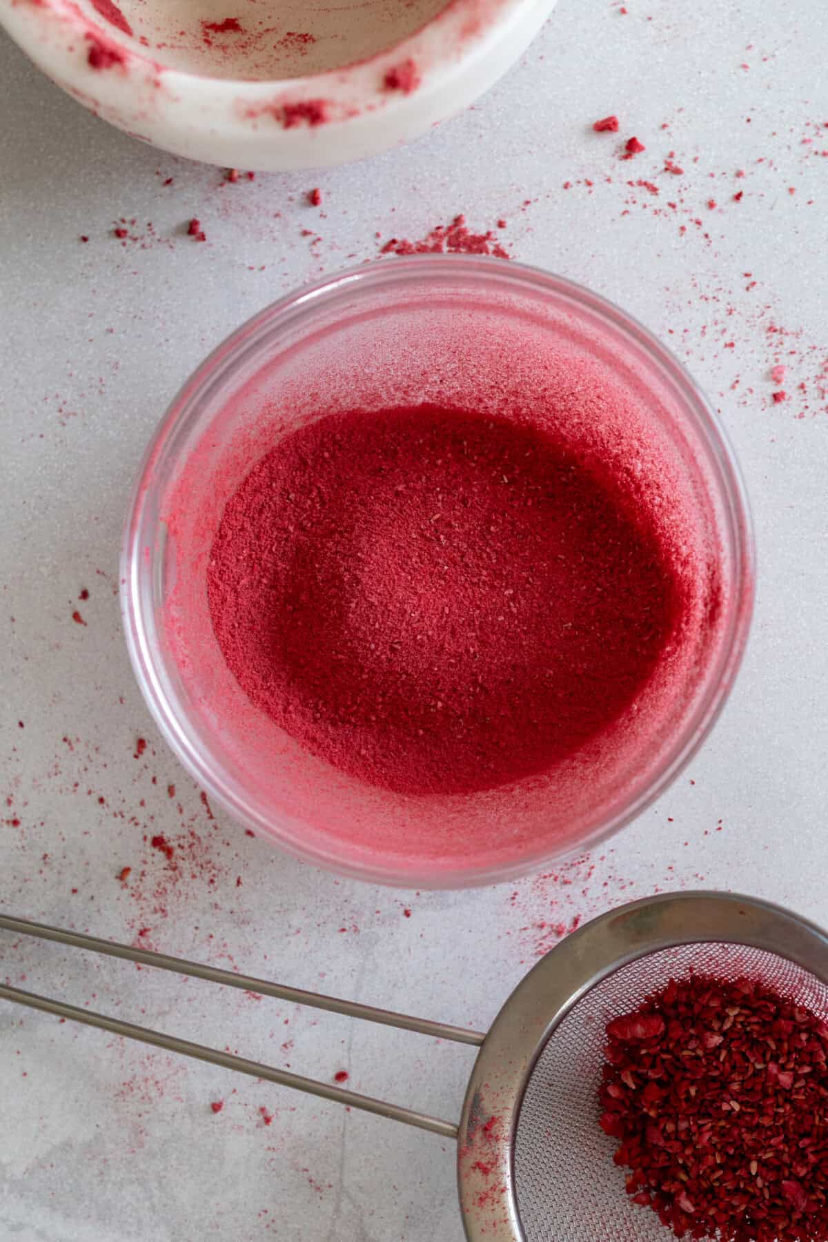 sifting freeze dried raspberries