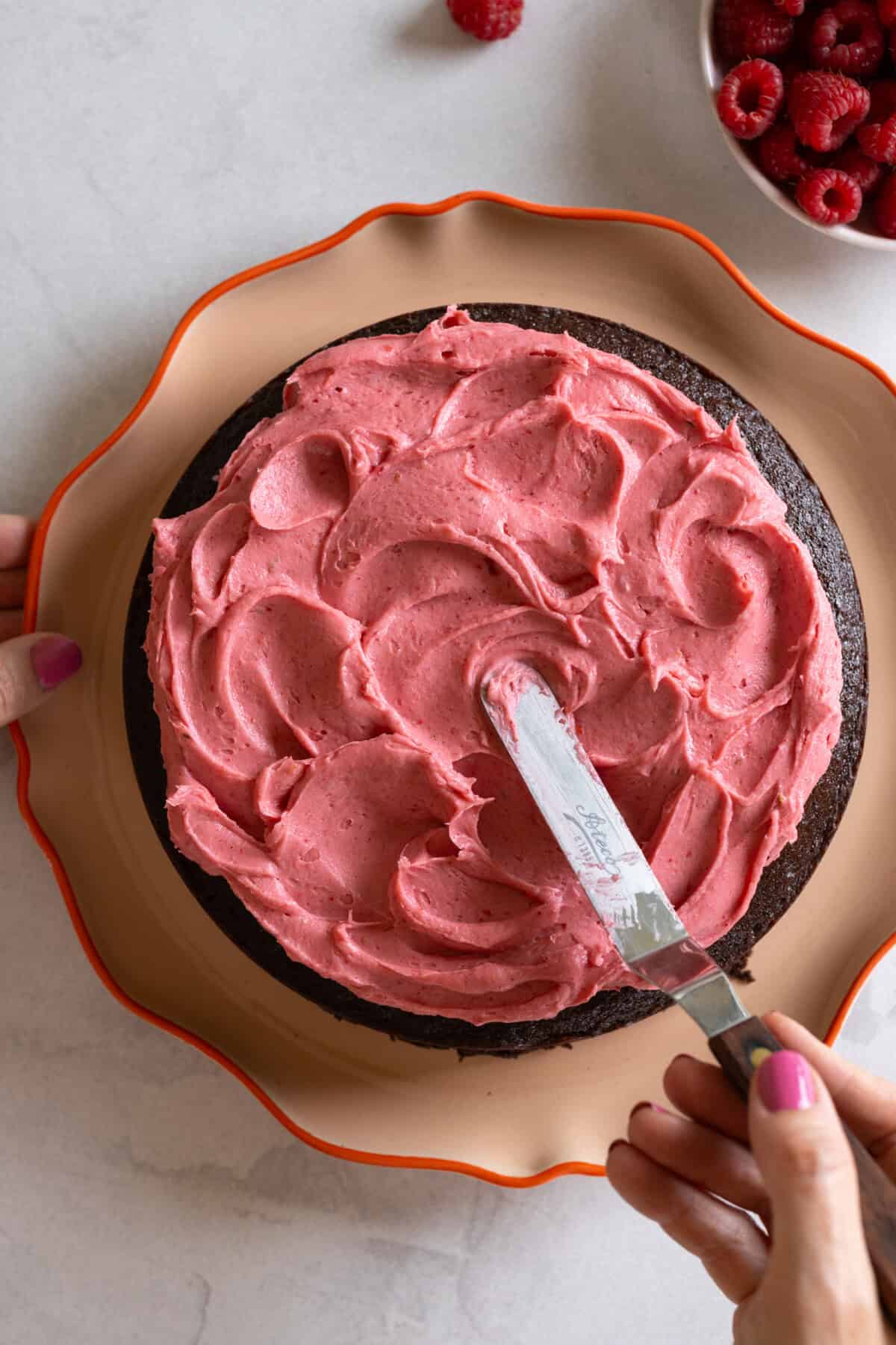 Frosting the Chocolate Cake with Raspberry Cream Cheese Frosting