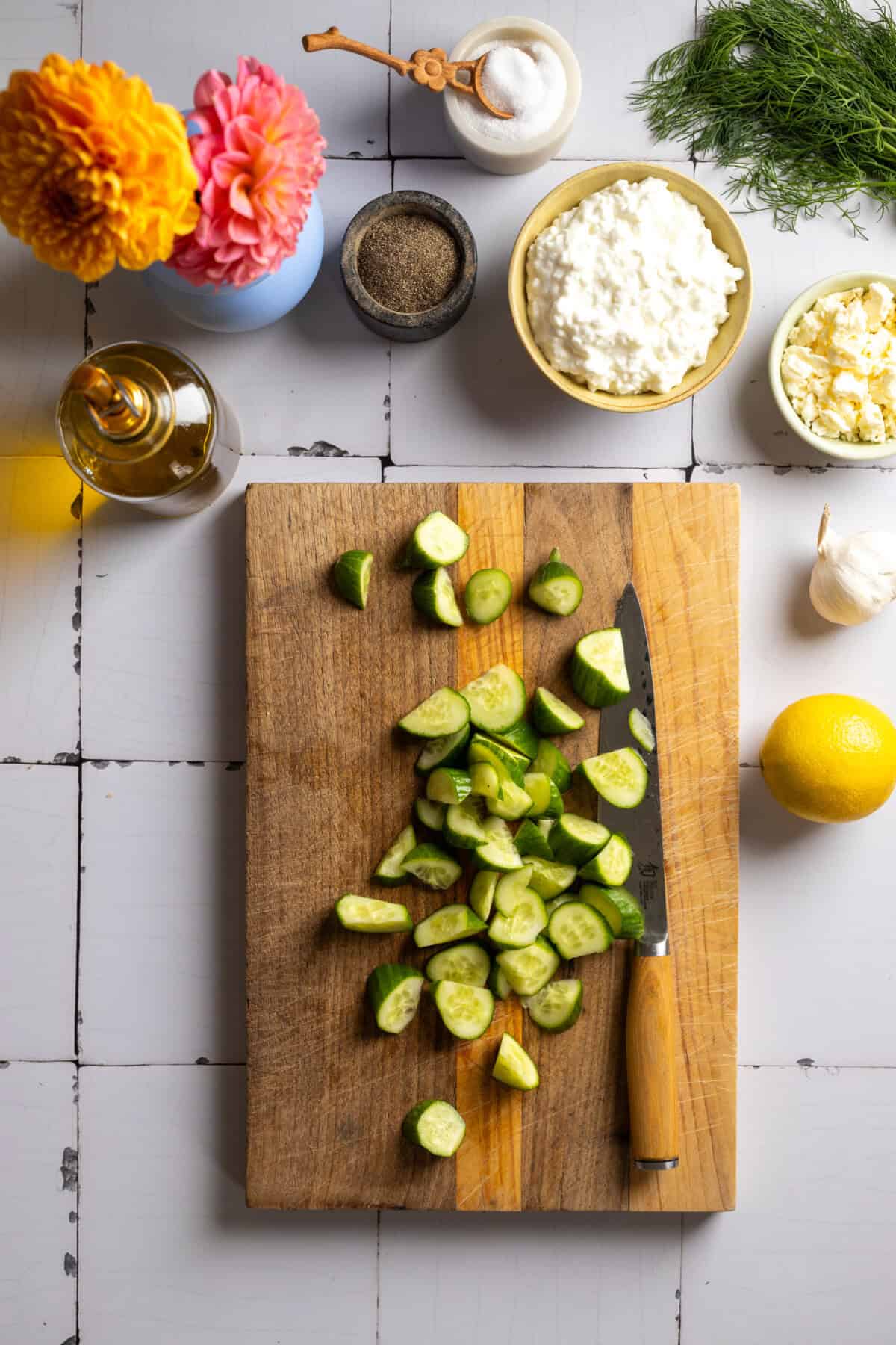 Chopping cucumbers for Tzatziki Toast
