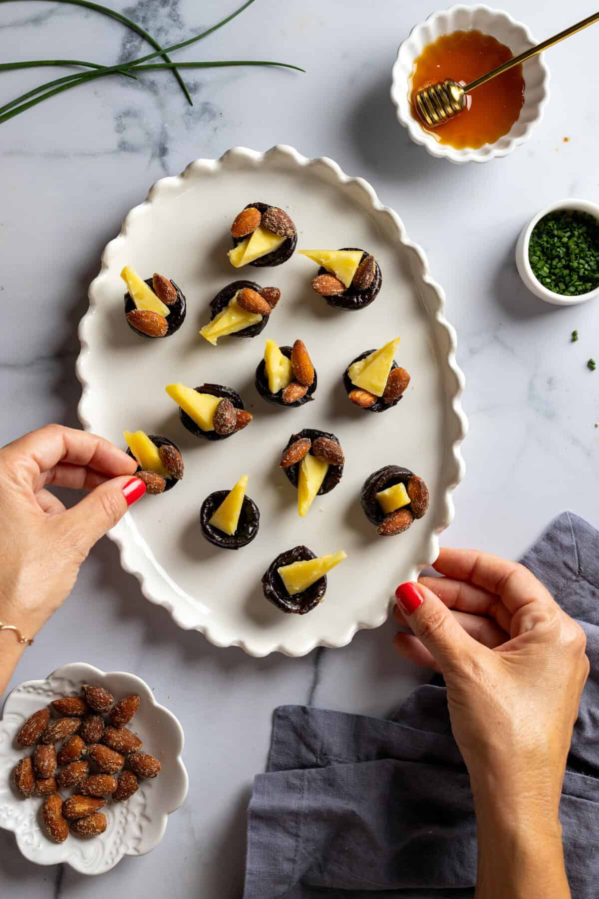 Adding almonds to prune cups