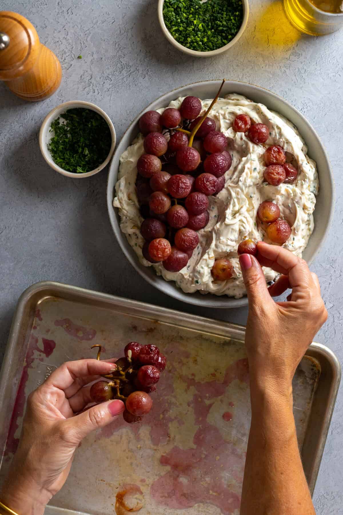 Topping Caramelized Onion Dip with roasted grapes
